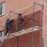 На улице Дагестанской восстановили облицовку фасада жилого дома